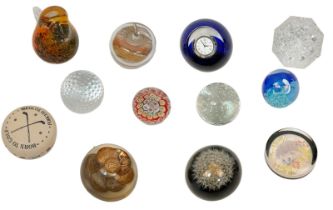 An Eclectic Mix of 12 Glass Paperweights.