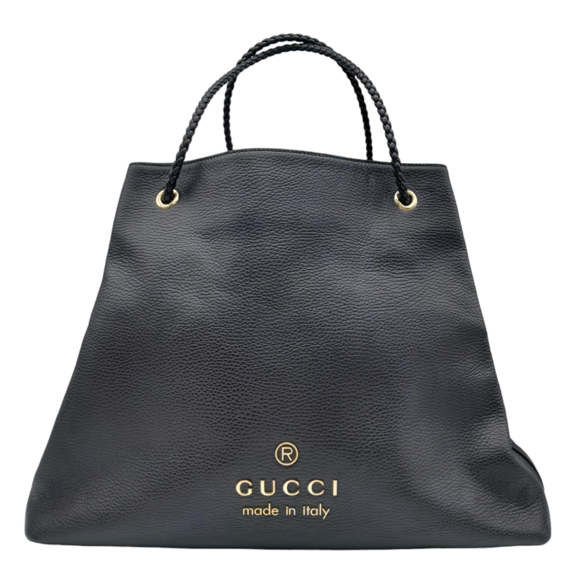 A large black Gucci calfskin Gifford bag with braided handles. Open top with black fabric