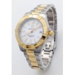A Tag Heuer Aquaracer Ladies Quartz Watch. Two tone gold plated steel bracelet and case - 32mm.