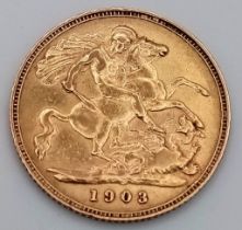 A 22K GOLD EDWARD VII HALF SOVEREIGN DATED 1903 .