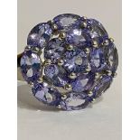 Beautiful TANZANITE CLUSTER RING set in SILVER with PLATINUM OVERLAY. Complete with ring box. Size N