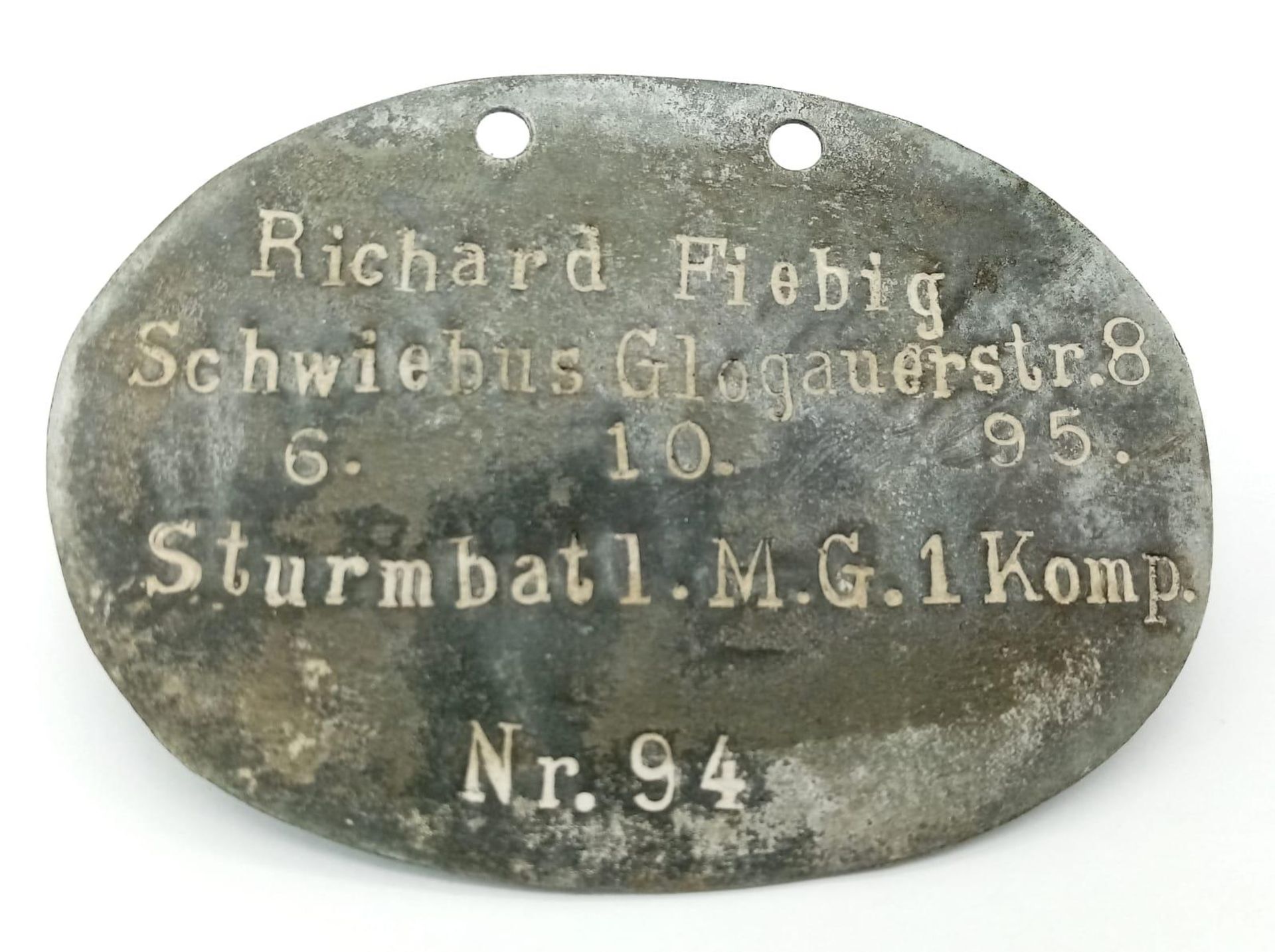 WW1 Imperial German Dog Tag to a soldier who was with No 1 Machine Gun Company.