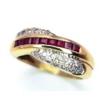 A FANCY 9K YELLOW GOLD DIAMOND & RUBY CROSSOVER RING, WEIGHT 3.7G SIZE P