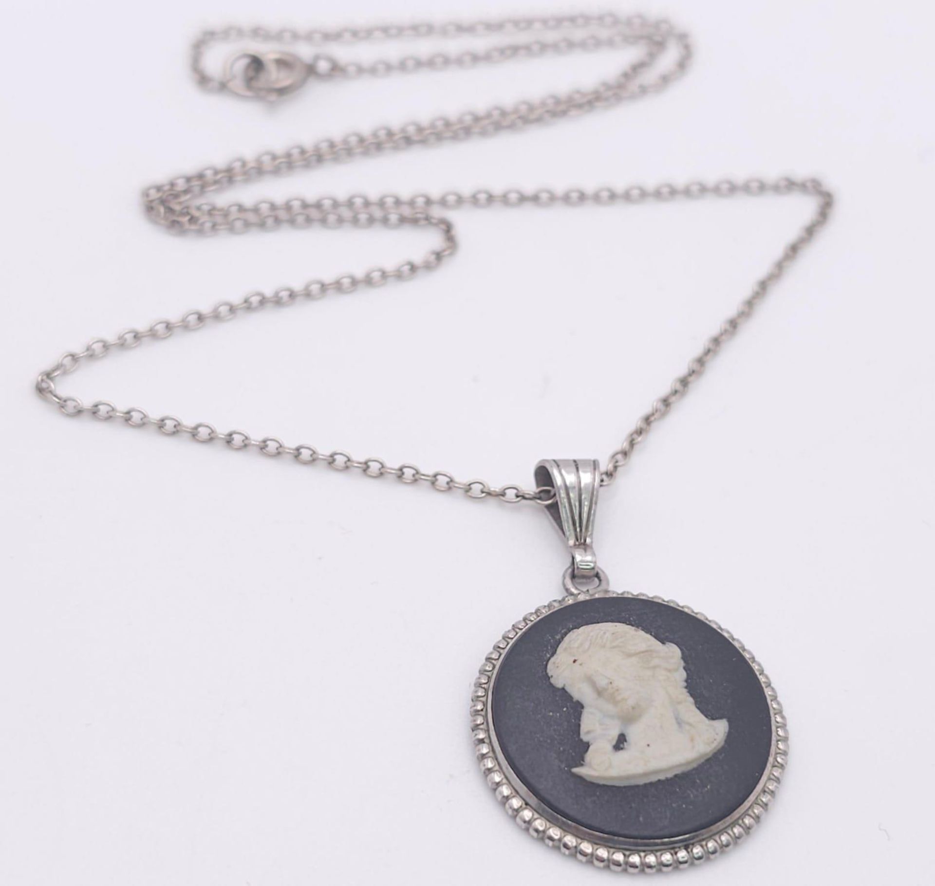 A sterling silver Cameo pendant on silver belcher chain. Total weight 5.3G. Total length 43cm.