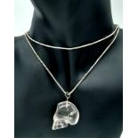 A Sterling Silver and Carved Quartz Skull Pendant Necklace. 62cm Length. The Skull Measures 3cm