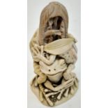 An interesting miniature vase with two frogs and a fallen bird inside, height: 51 mm, AND a carved