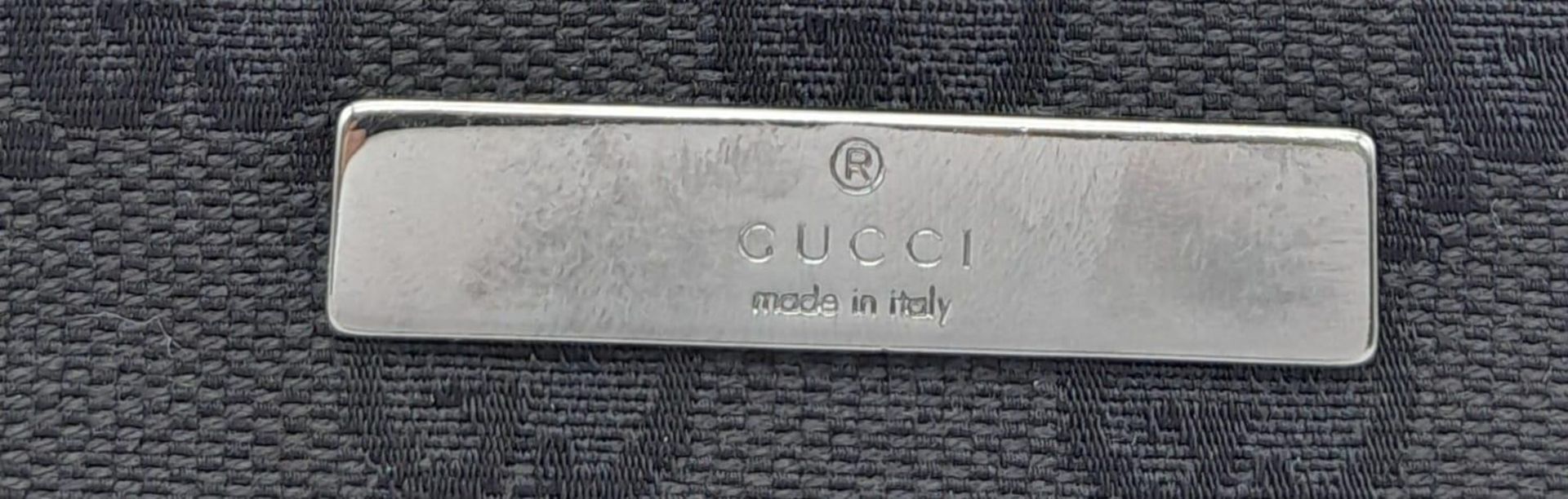 A Gucci Black Monogram Pochette Boat Bag. Textile exterior with black and silver-toned hardware, - Image 7 of 7