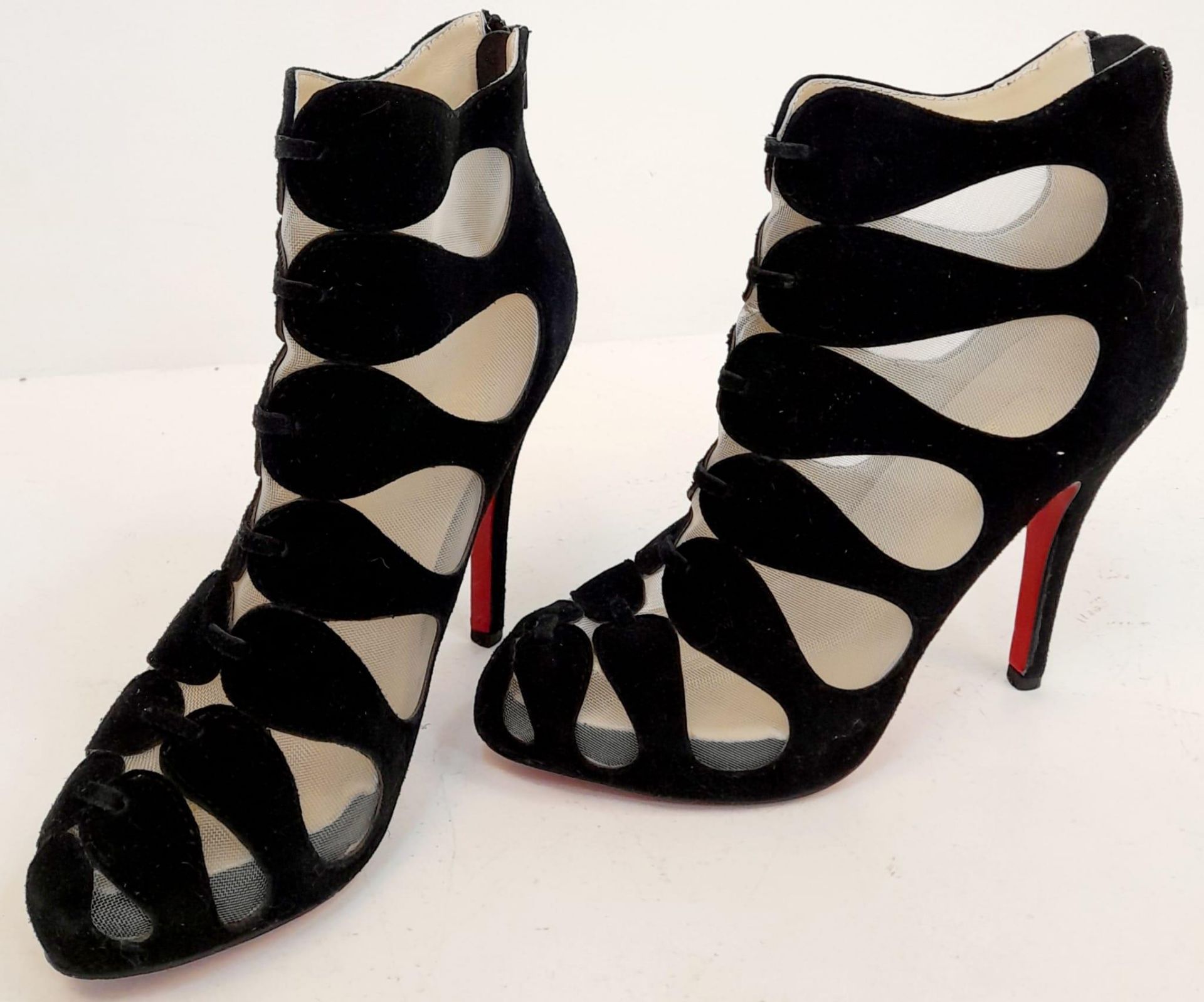 A pair of Louboutin high heels "see through" in black suede, lightly used. Size 40.
