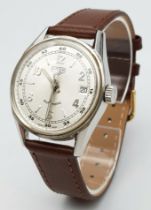 A Tag Heuer Automatic Gents Watch. Brown leather strap. Stainless steel case - 36mm. Silver tone