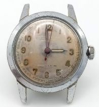 A Vintage, ORATOR watch, round face 32 mm, cream dial, with Arabic numerals, stainless steel back,