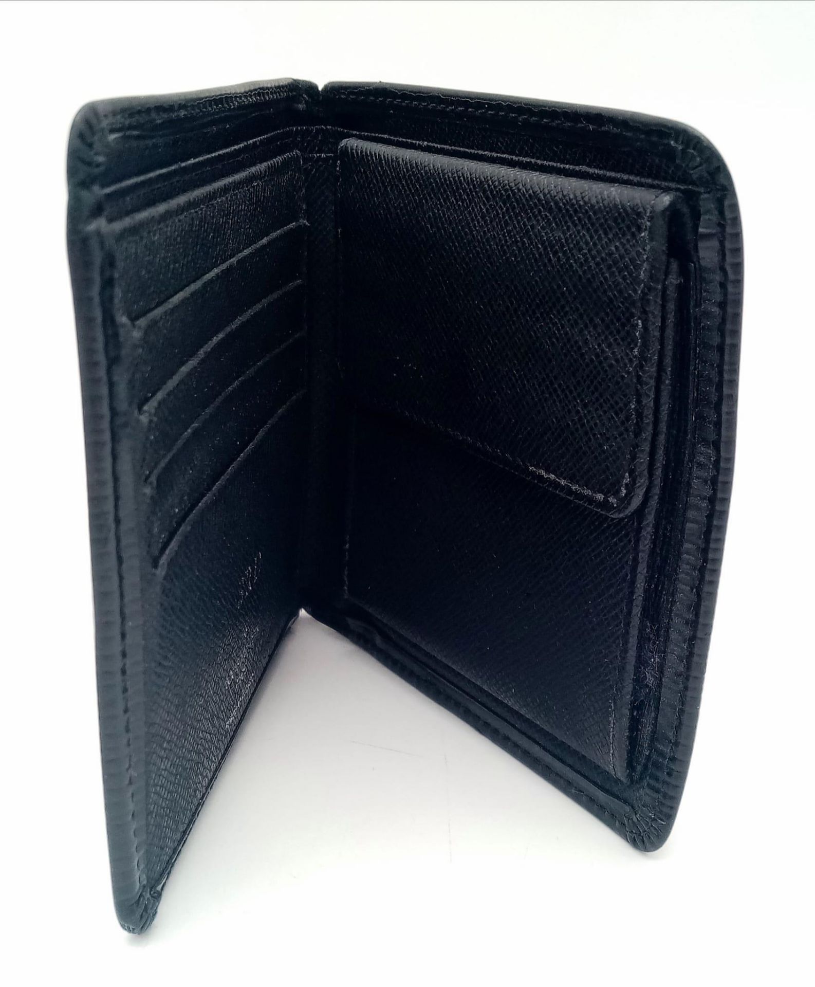 A Louis Vuitton black cowhide leather wallet. Engraved with initials SRD. Size approx. 11x11cm. - Image 2 of 5