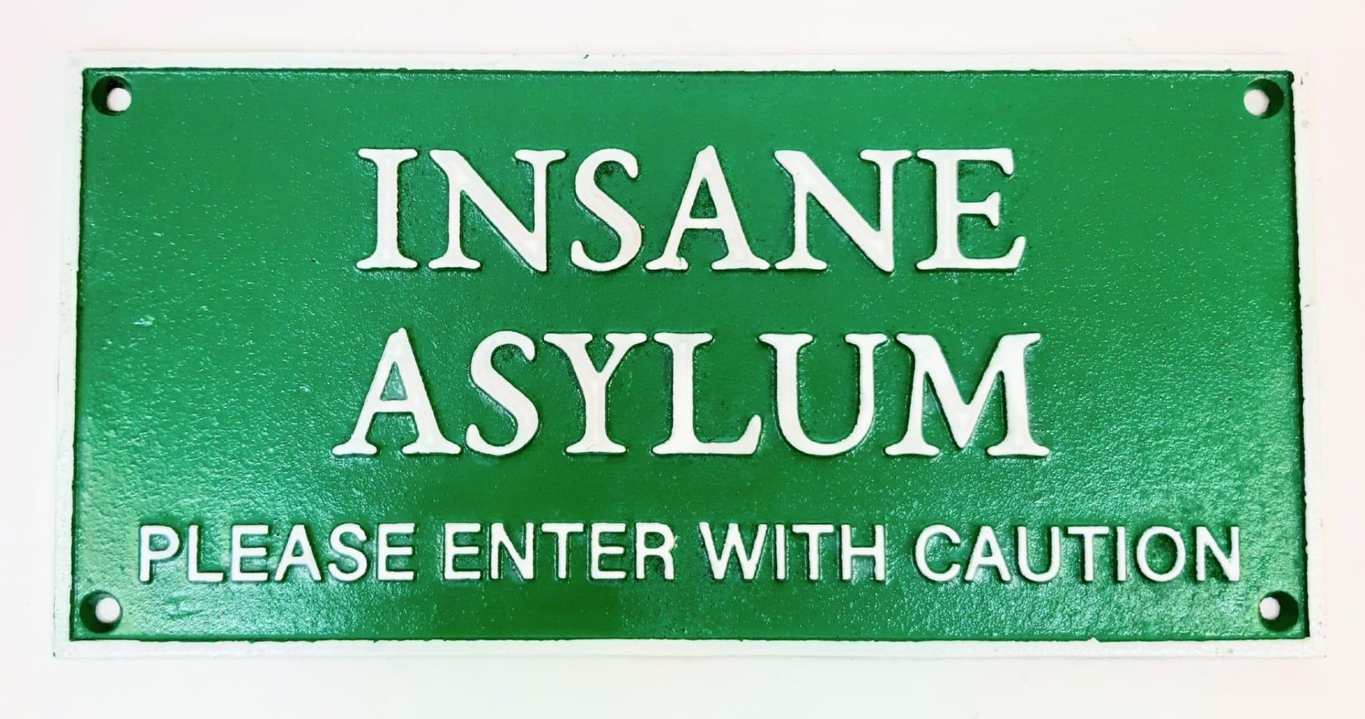 No large family should be without one! A cast iron sign “INSANE ASYLUM, PLEASE ENTER WITH CARE”.