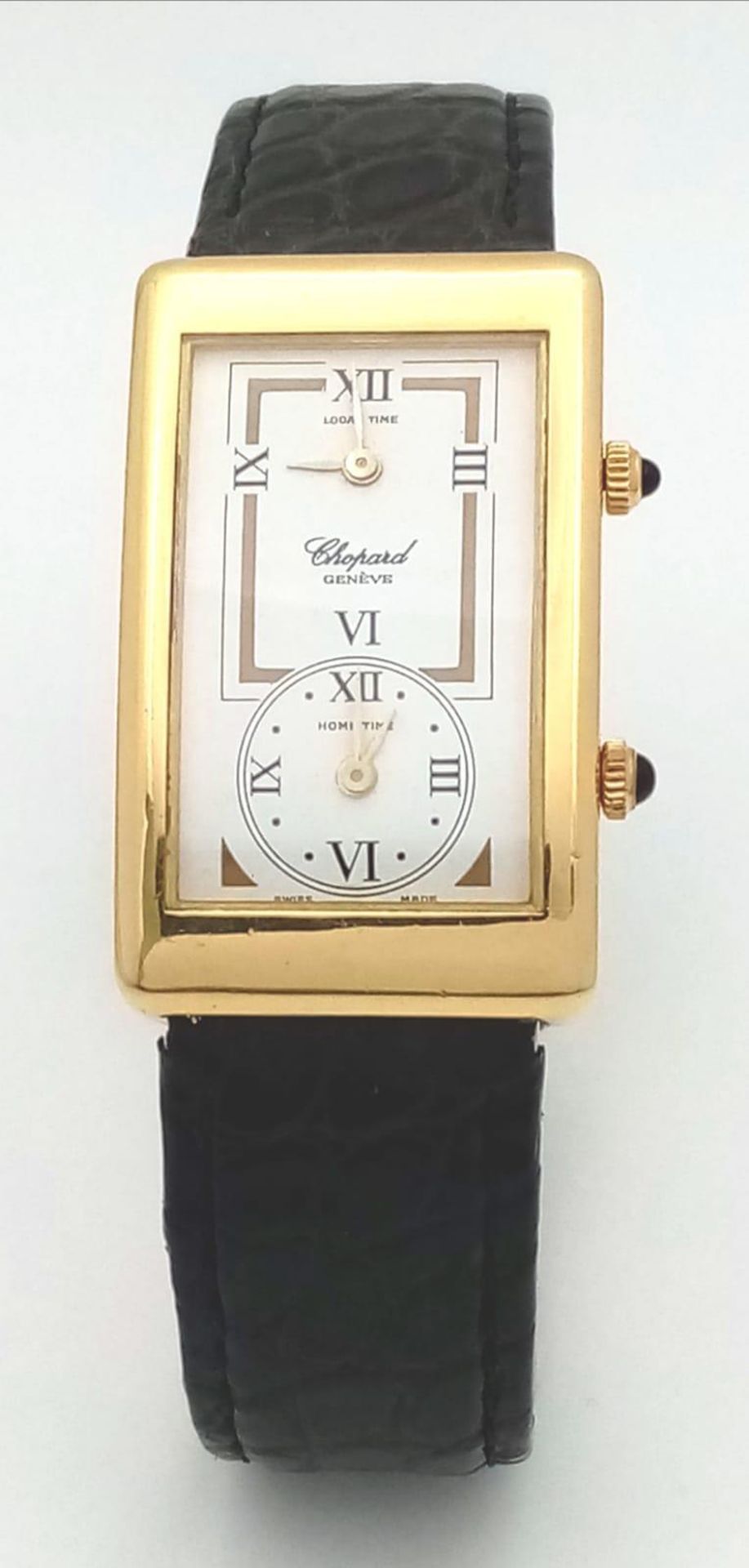 A Chopard 18K Gold Home Time (Dual Time) Gents Watch. Black leather strap. 18K gold rectangular case