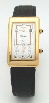 A Chopard 18K Gold Home Time (Dual Time) Gents Watch. Black leather strap. 18K gold rectangular case
