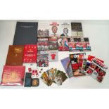 A Potpourri of Manchester United Collectibles: Books, Pictures and Programmes. Over thirty items.