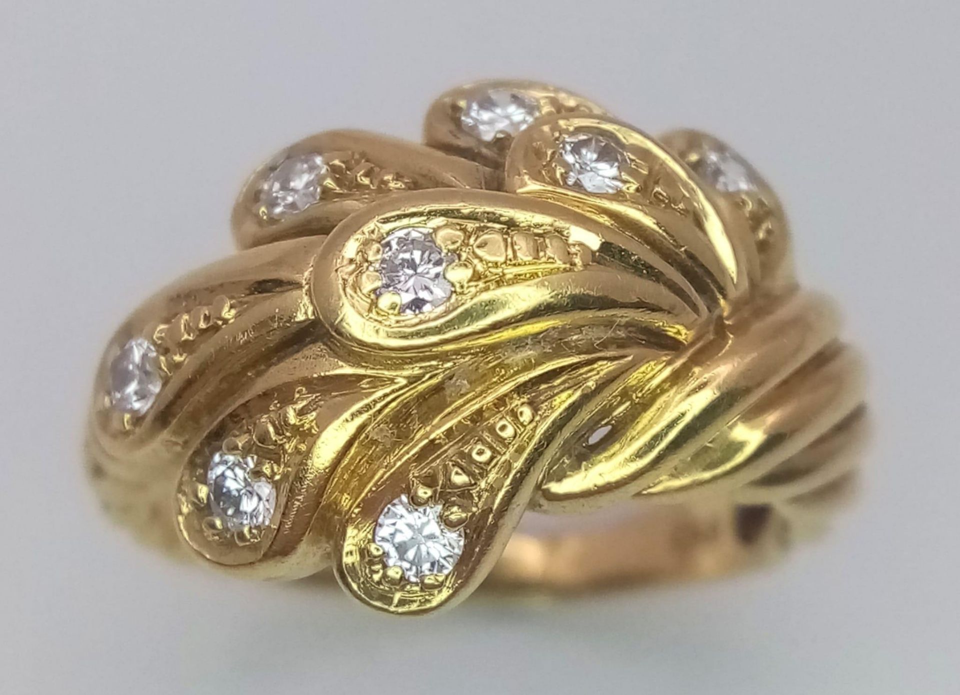 An 18 K yellow gold ring with an unusual design and eight good quality round cut diamonds. Size: - Image 2 of 4