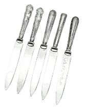 A collection of 5 antique sterling silver knives with different fabulous engravings on handles. Full