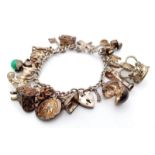 A 925 silver multiple charms bracelet include Royal crown, racket, etc. Total weight 52.6G. Please