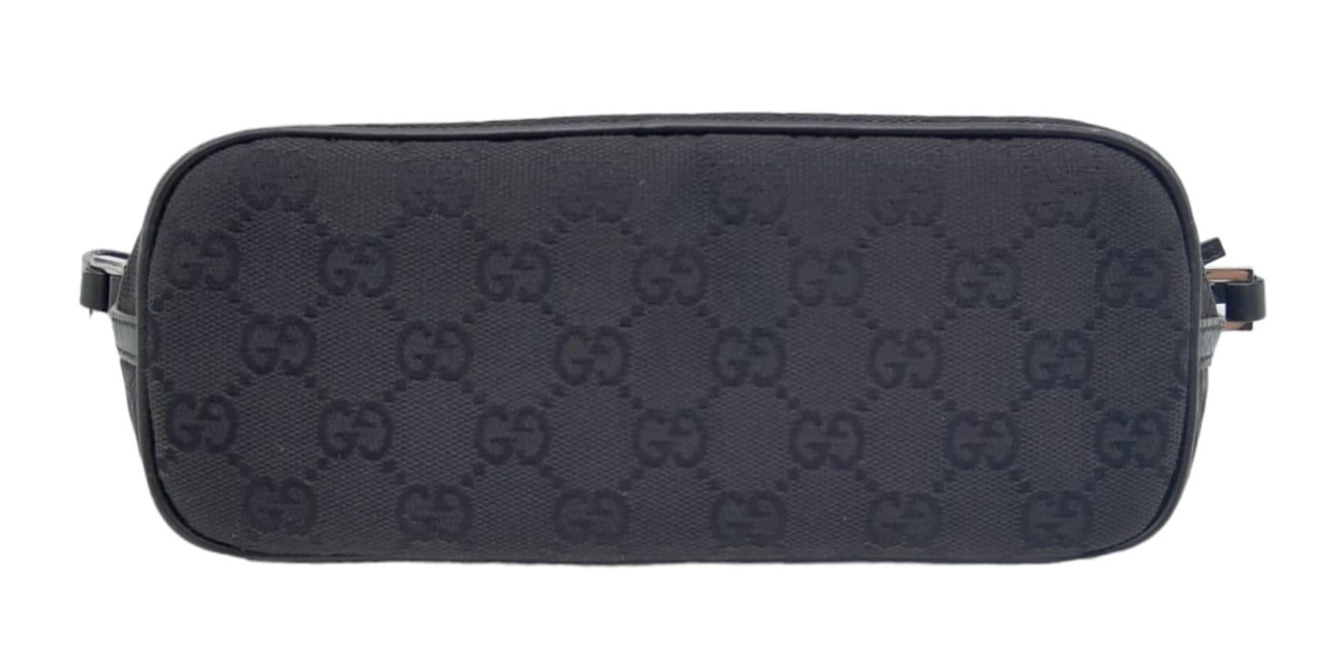 A Gucci Black Monogram Pochette Boat Bag. Textile exterior with black and silver-toned hardware, - Image 4 of 7