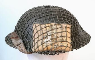 WW2 British MK II Helmet with Cam Net and 1944 Dated (D-Day) Field Dressing.