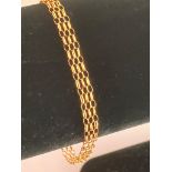 Italian 9 carat GOLD BRACELET. Triple chain-link design. 1.8 grams. 18.5 cm.