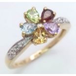 A LOVELY 10K YELLOW GOLD DIAMOND AND GEMSTONE SET FANCY FLOWER DESIGN RING, WEIGHT 2.3G SIZE N