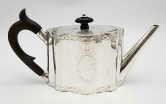 A 1785 Hester Bateman George III Silver Teapot. Oval form with empty cartouche to side. Minimalist