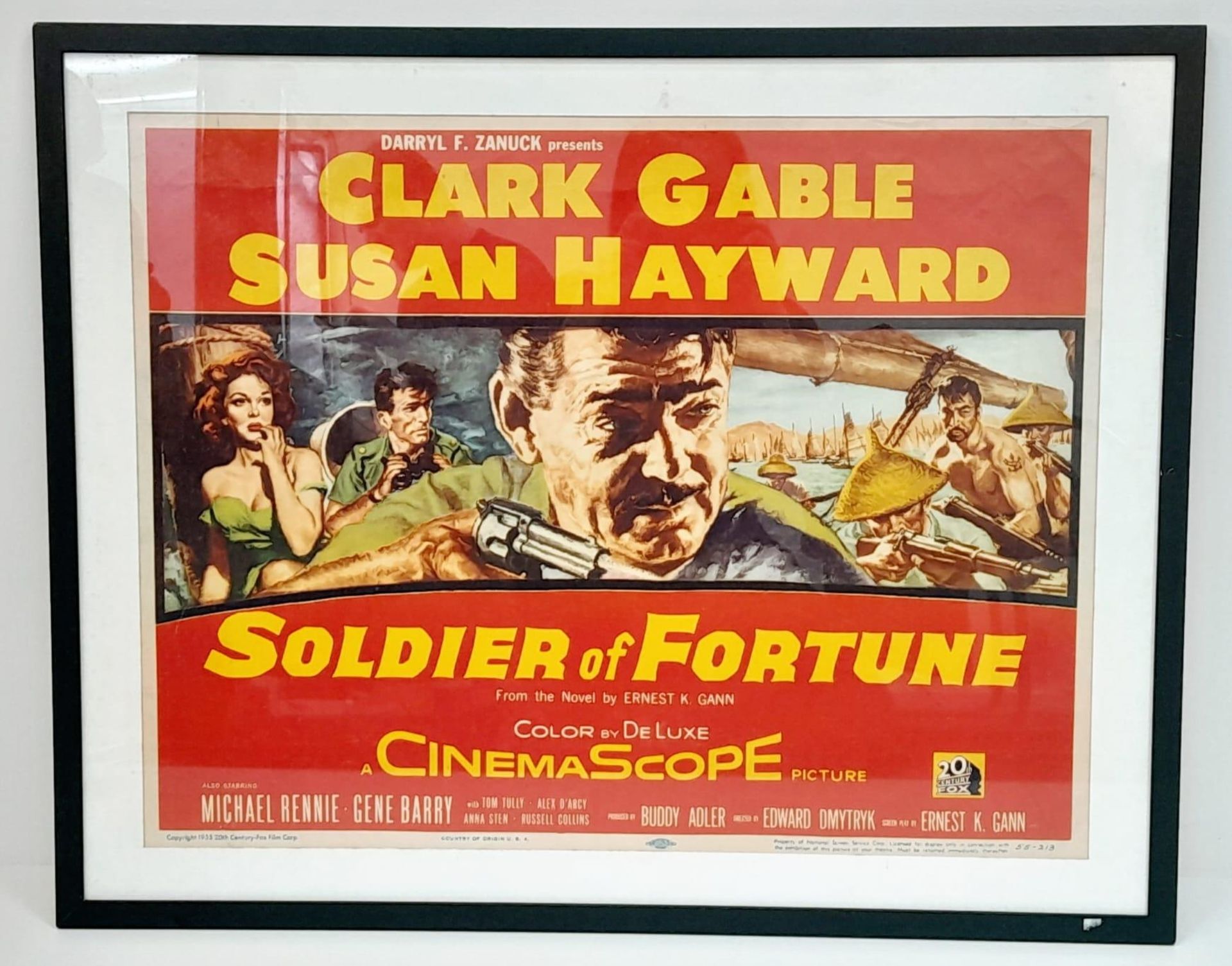 A FRAMED MOVIE POSTER FOR "SOLDIERS OF FORTUNE" STARRING CLARK GABLE AND SUSAN HAYWOOD .CIRCA 1955 .
