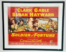 A FRAMED MOVIE POSTER FOR "SOLDIERS OF FORTUNE" STARRING CLARK GABLE AND SUSAN HAYWOOD .CIRCA 1955 .