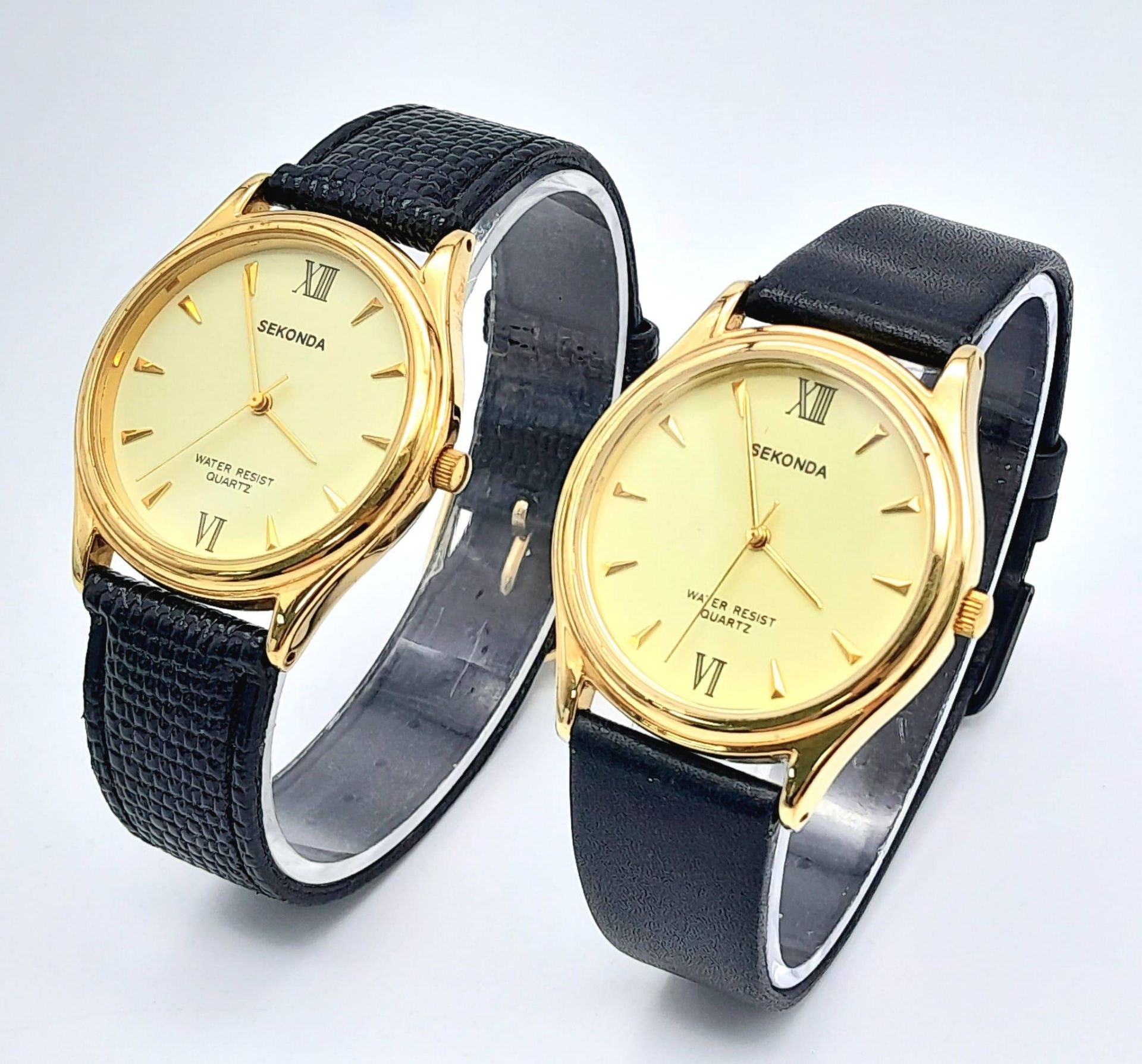 Two Sekonda Quartz Gents Watches. Black leather straps. Gilded stainless steel cases - 34mm. Both in