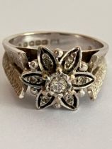Impressive 18 carat WHITE GOLD and DIAMOND RING. Having seven DIAMONDS mounted to top in floral