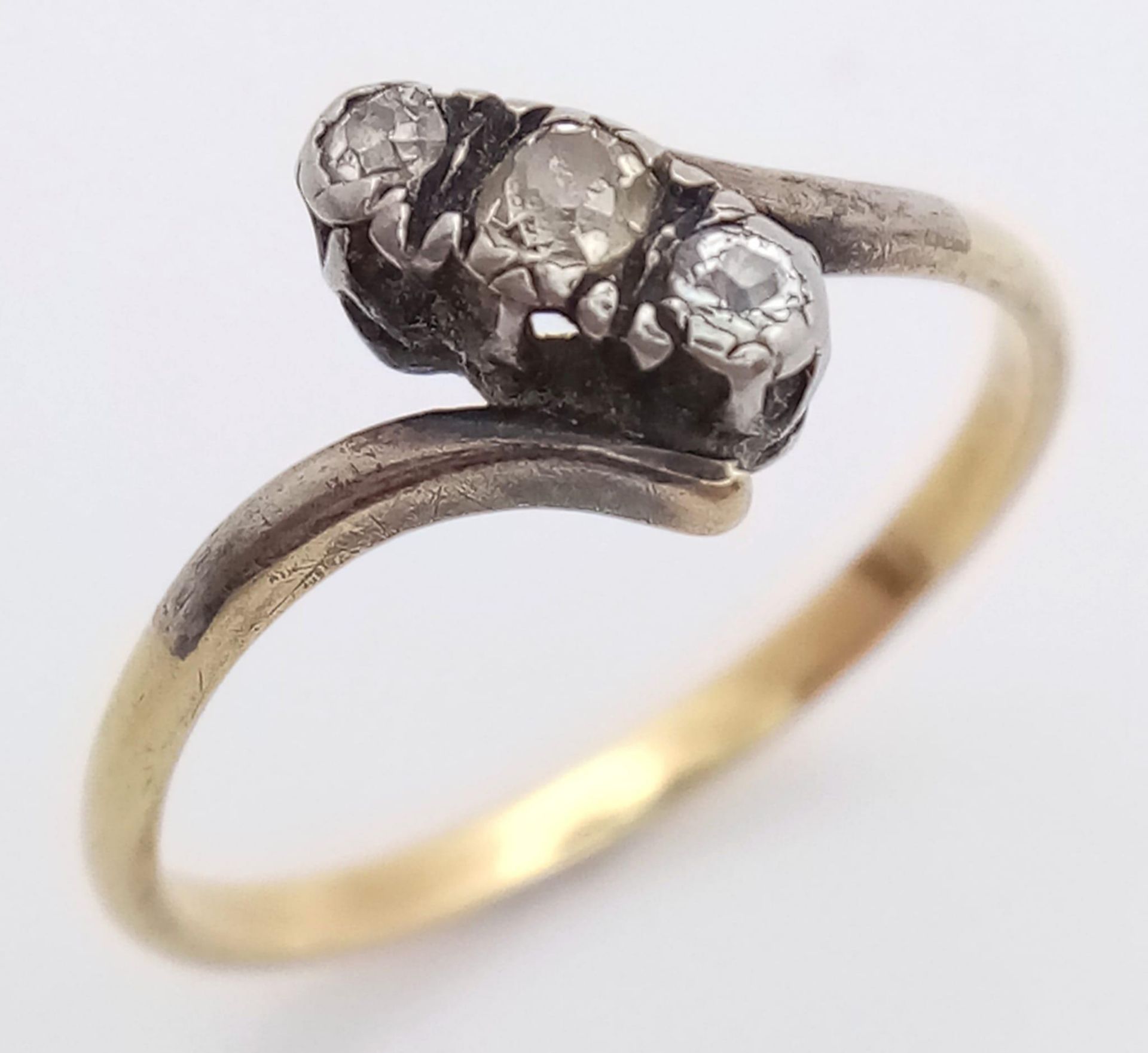 A Vintage 18K Yellow Gold (tested) Old-Cut Diamond Crossover Ring. Size O. 2.25g total weight. - Image 2 of 4