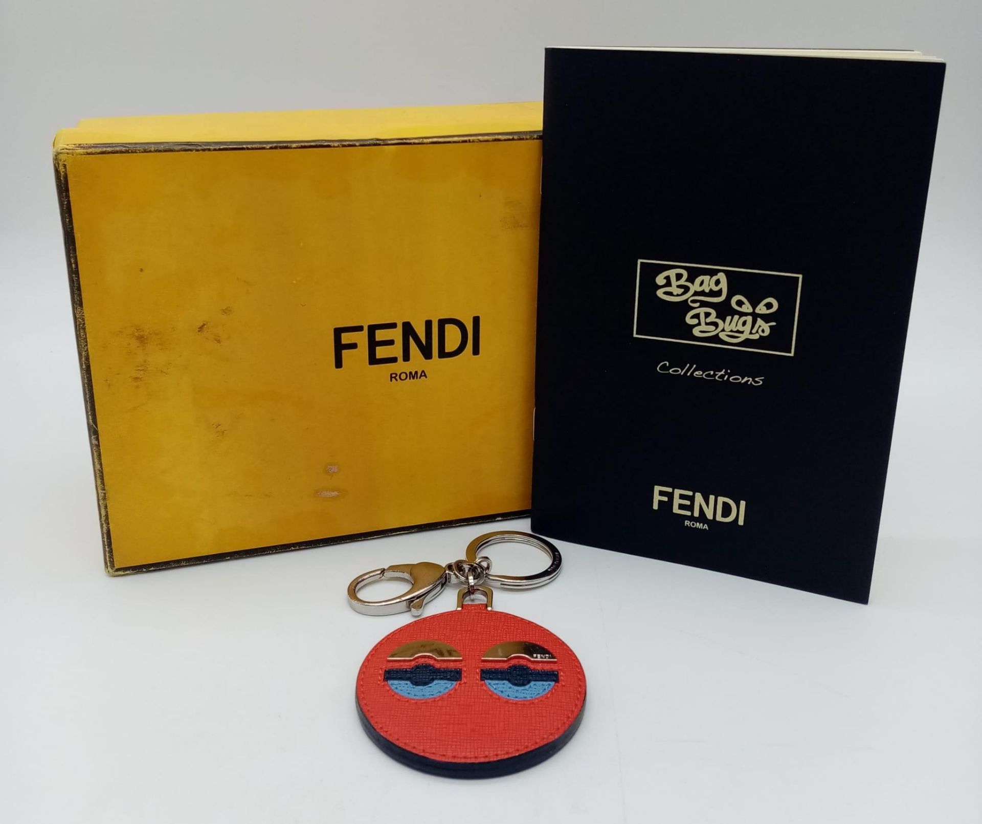 A red leather Fendi monster keychain, silver tone hardware. Diameter6cm. Comes with box. ref:16444