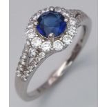 Sterling Silver Blue central stone surrounded by sparkling white stones, ring. Size: N Weight: 2.3g
