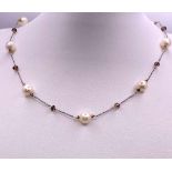 A stunning 14kt White Italian Gold Necklace, adorned with 3.40cts of Pearls. Measuring 48cm in