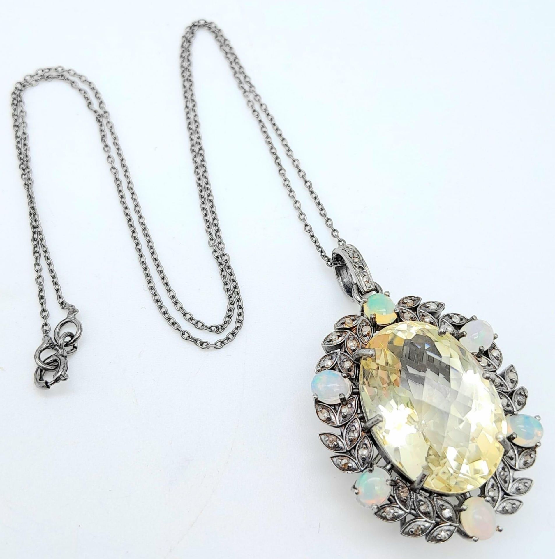 A Citrine Pendant with Opal and Diamond Surround on 925 Silver Chain.22ct citrine, 1.30ctw opals,