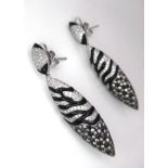 Stunning pair of 18kt White Gold, Diamond encrusted Drop Earrings. A unique 'pea-pod ' design