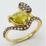 A Nigerian Tourmaline & Diamond Crossover Ring set in 925 Gold Plated Silver. Tourmaline - 0.40ct.