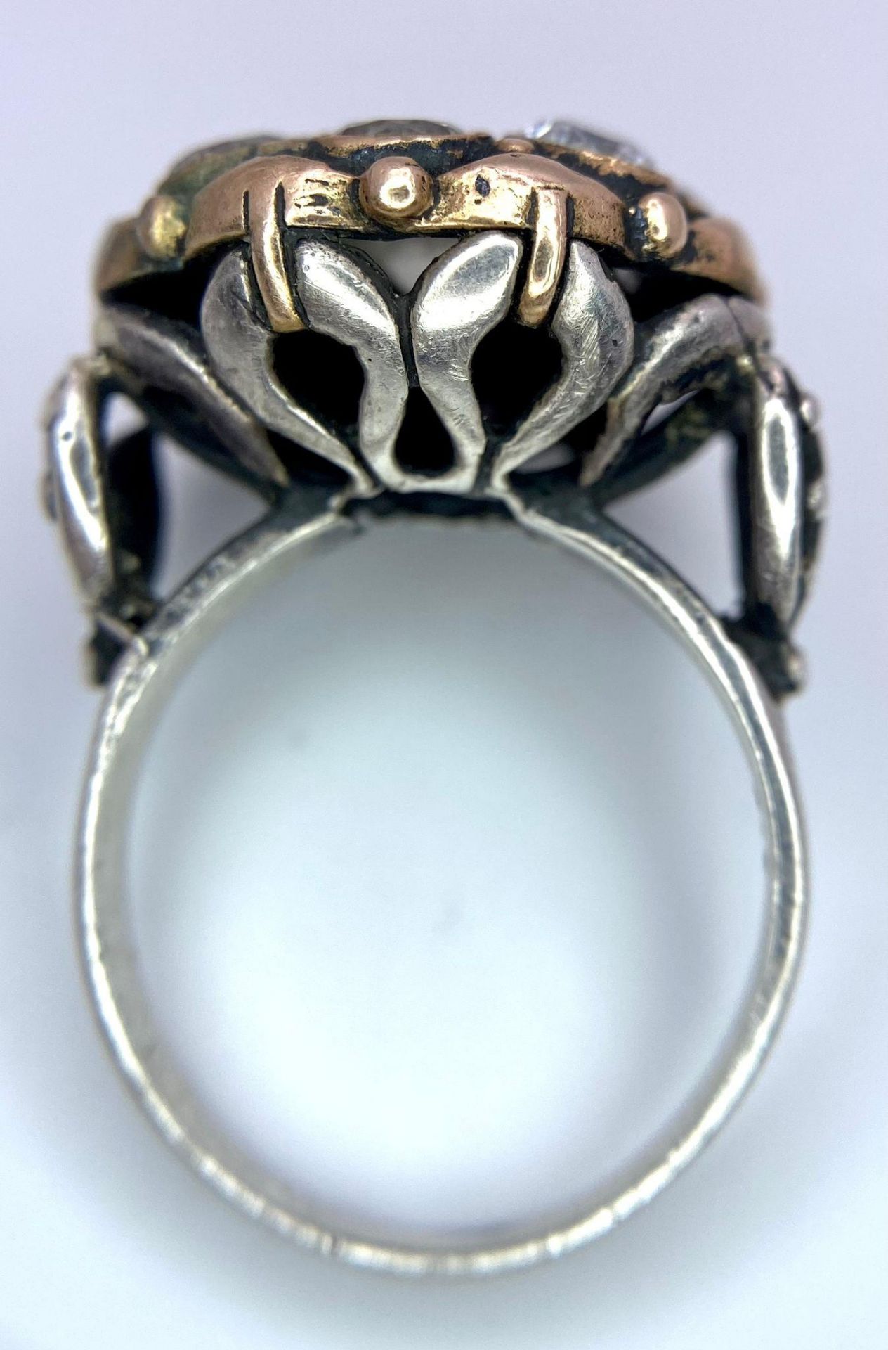 A 925 Silver Ring, with a fancy circular design adorned with white stones and interlaced with gold - Image 3 of 4