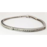 A 14K WHITE GOLD AND DIAMOND SECTIONED BRACELET WITH SAFETY CATCH . 13.8gms