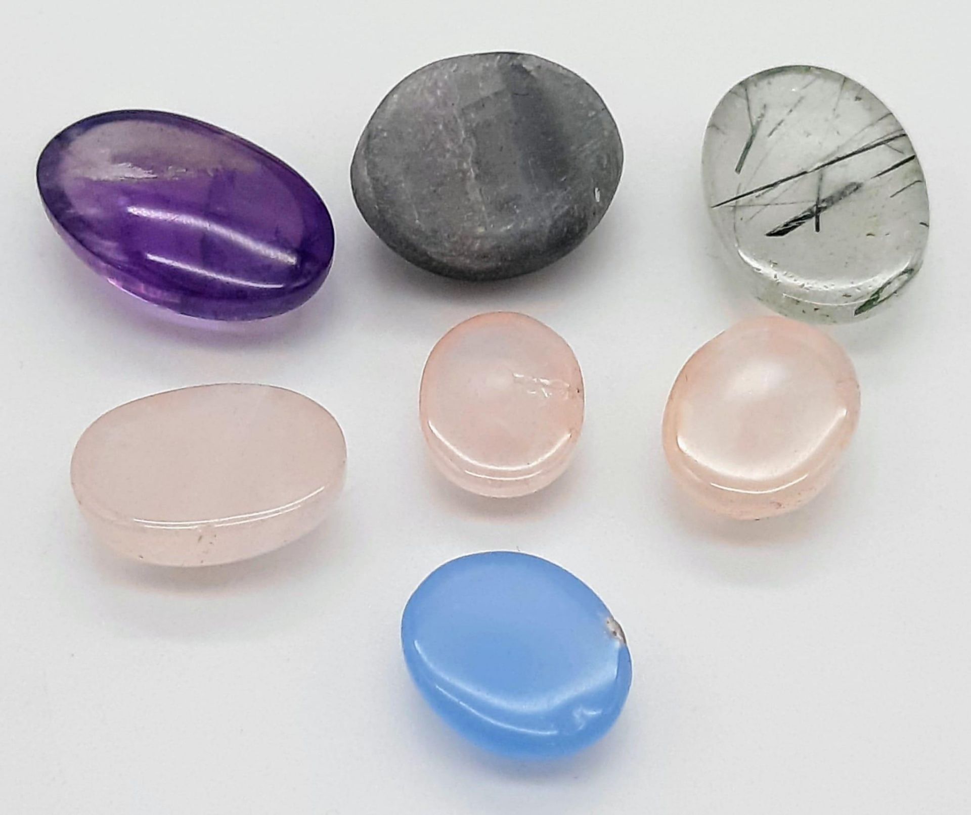 A 45.40ctw Mixed lot of 7 Oval Cut Cabochon Gemstones - Rose Quartz, Amethyst, Rutile Quartz, etc. - Bild 3 aus 3