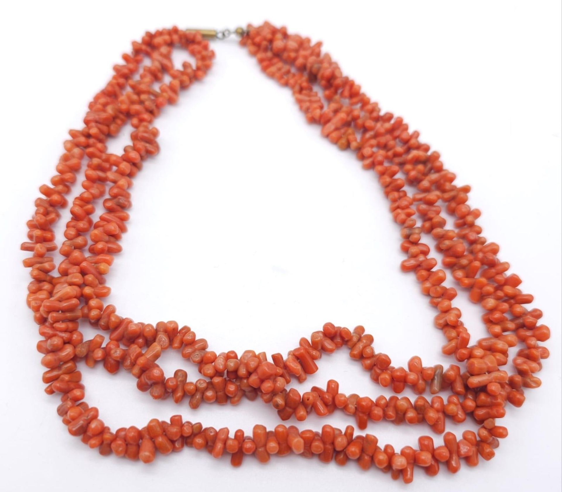 Three Strand Orange Coral Necklace. Measuring 42cm in length, this bold necklace is a bright