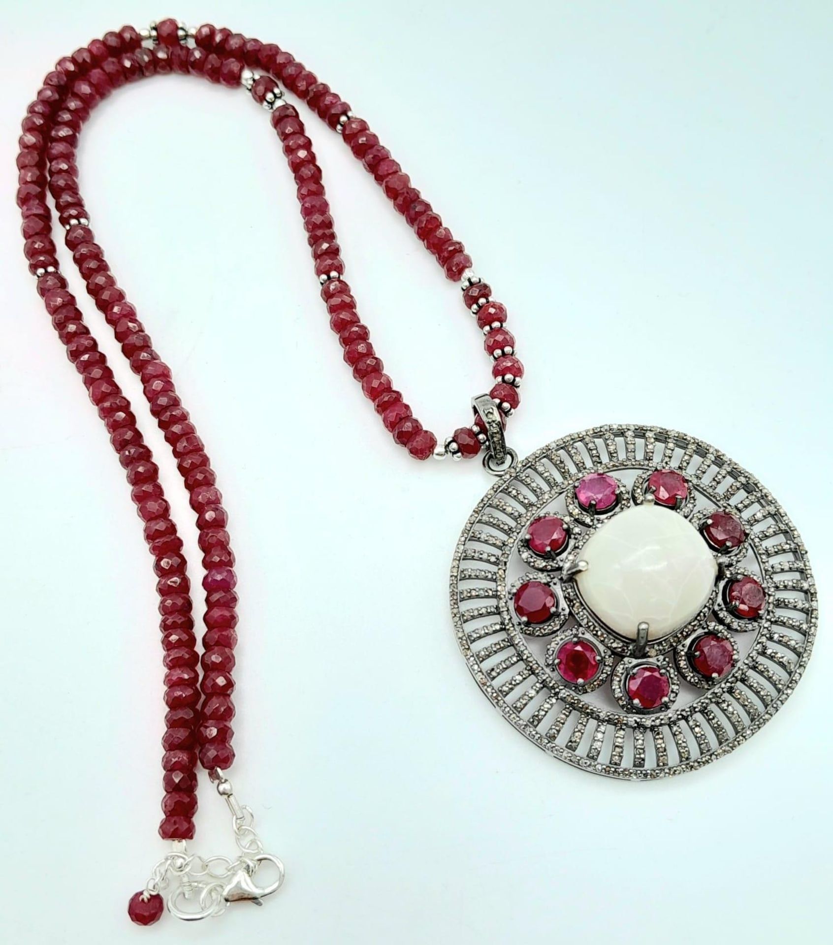 An Opal Pendant with Ruby and Diamond Surround on a Detachable Ruby Necklace. 16.5ct opal, 7.5ctw - Image 3 of 6