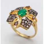A Zambian Emerald and Diamond Ring set in Gold Plated 925 Silver. Weight - 3.80g. Emerald- 0.40ct.
