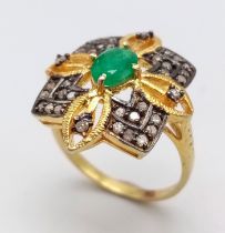 A Zambian Emerald and Diamond Ring set in Gold Plated 925 Silver. Weight - 3.80g. Emerald- 0.40ct.