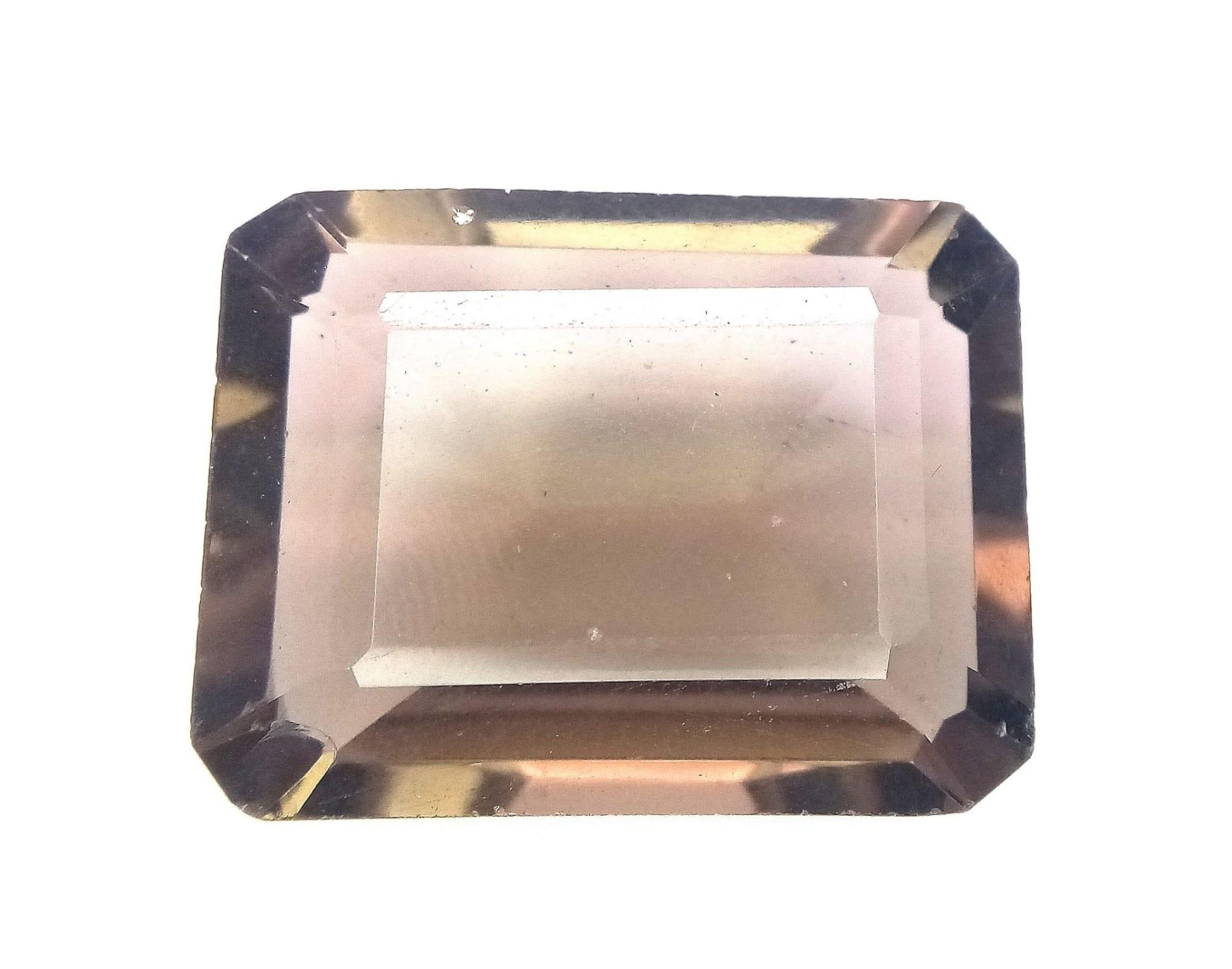 A 26.20ct Faceted Rectangular Cut Smoky Quartz. Comes with GLI certificate. Ref: CV17