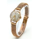 A Vintage 9K Yellow Gold Omega Watch. 9k gold mesh bracelet. 9k gold case - 19mm. White dial.