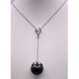 An 18KT White Gold Necklace with a Tahitian Pearl, 5.5CTW Diamond encrusted Pendant. The beautifully