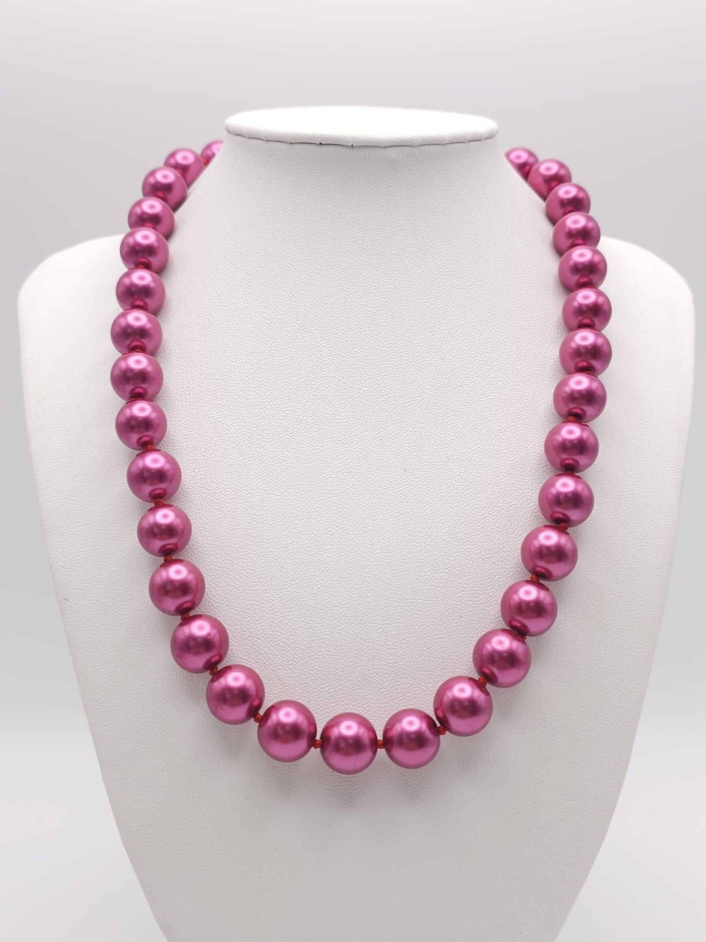 A Metallic Pink South Sea Pearl Shell Bead Necklace. 12mm beads. 44cm necklace length.