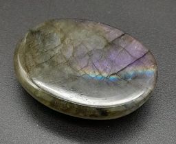 A 49.95Ct Cabochon Labradorite in Oval Shape. GLI Certified.